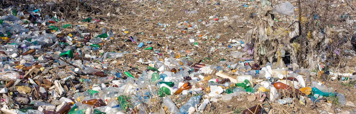 A plastic refuse site showing a lot of plastic lying around.